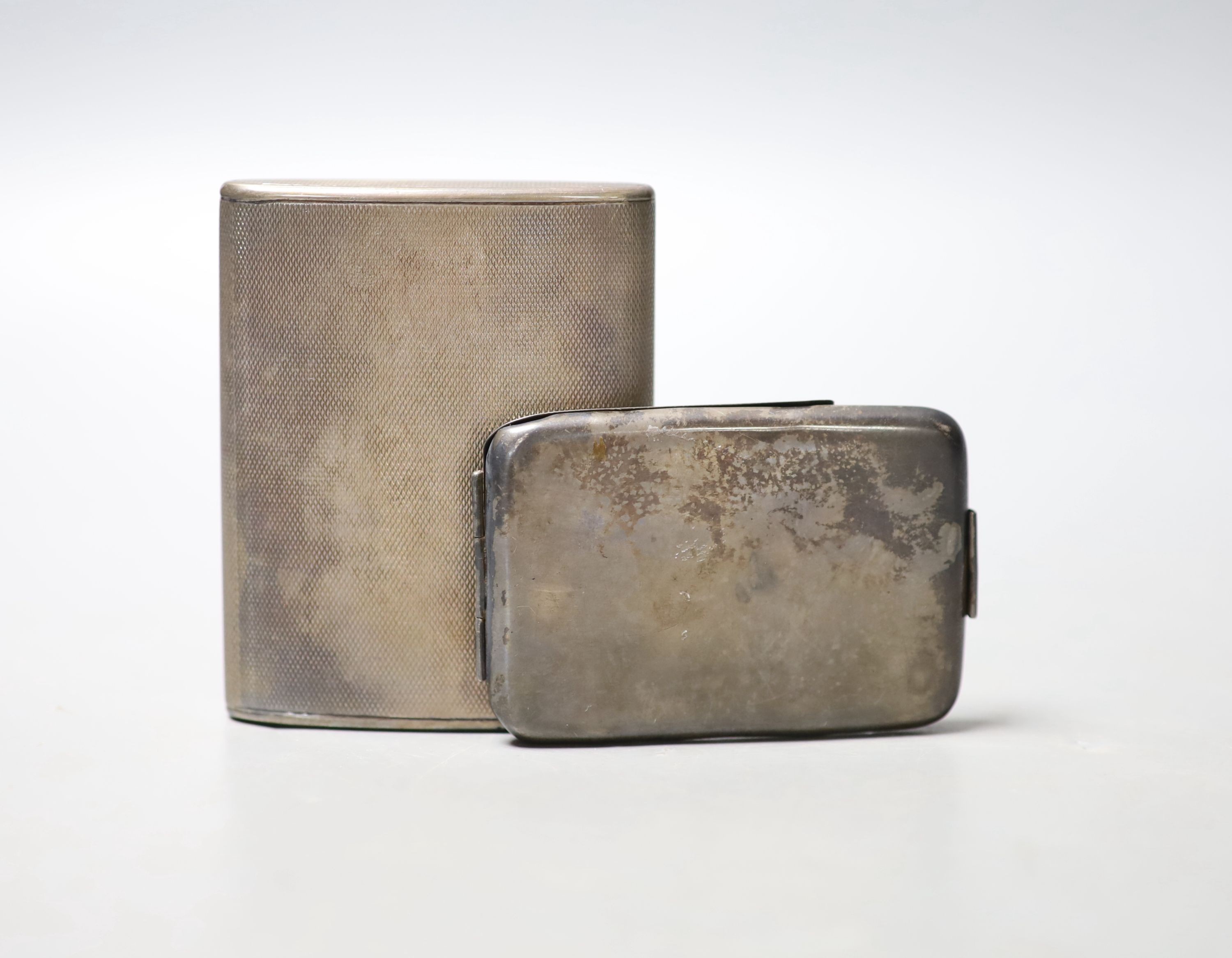 A George V engine turned silver cigarette case, London, 1919, 83mm and a later silver needle case.